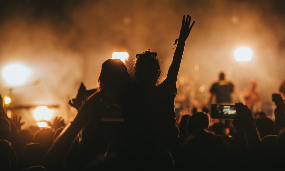 two-woman-in-the-crowd-at-a-music-festival.jpg
